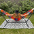 bright backyard patio hammock with tassels