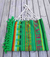 green boho hammock with fringe